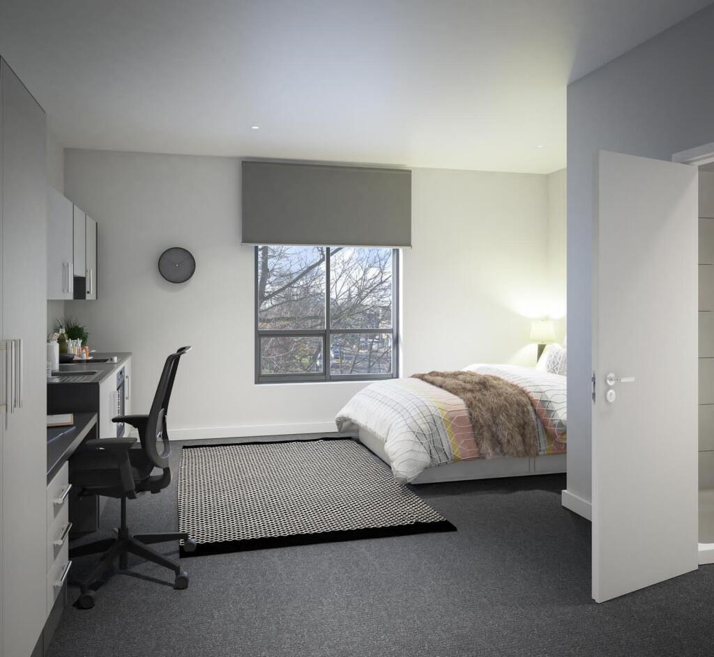 This inviting double bedroom features ample nat...