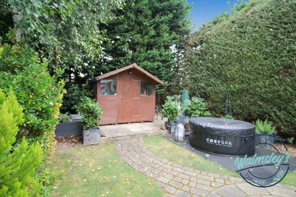 Garden shed and sitting areas to rear
