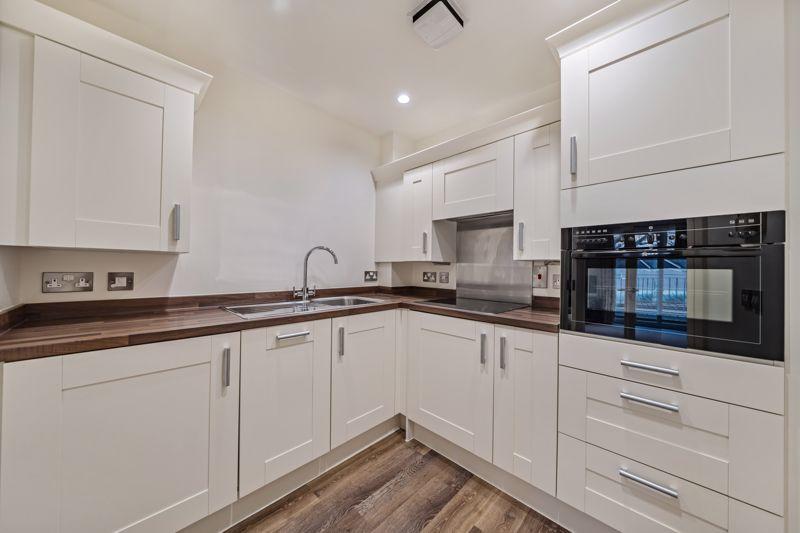 Kitchen with built-in appliances