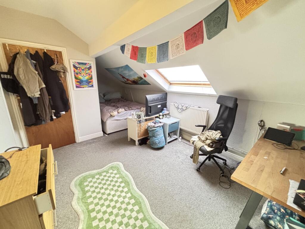 A bright and welcoming living room featuring a ...
