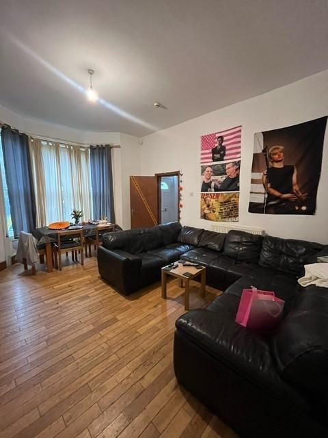 A spacious and welcoming living room featuring ...