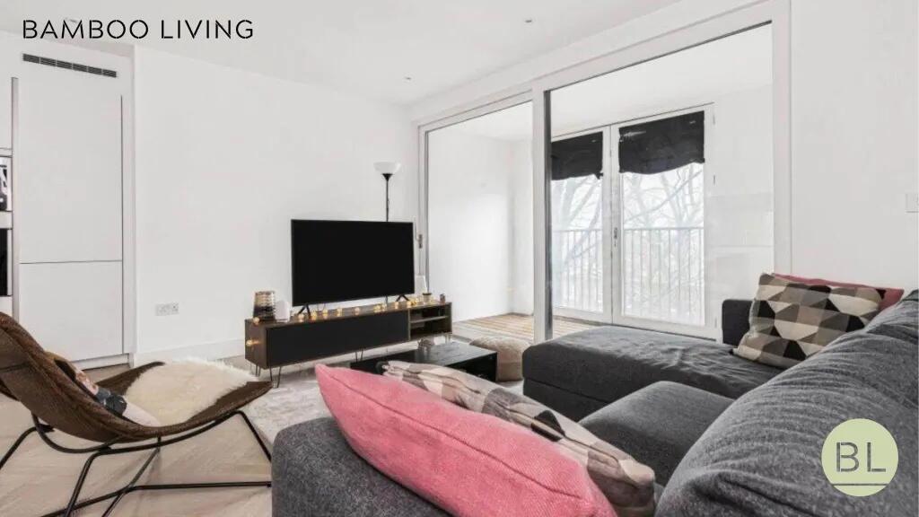 A modern and stylish living room featuring a la...