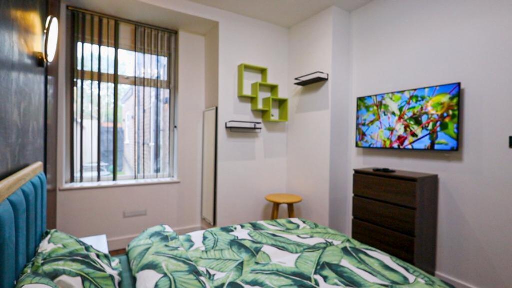 A bright and stylish double bedroom featuring m...