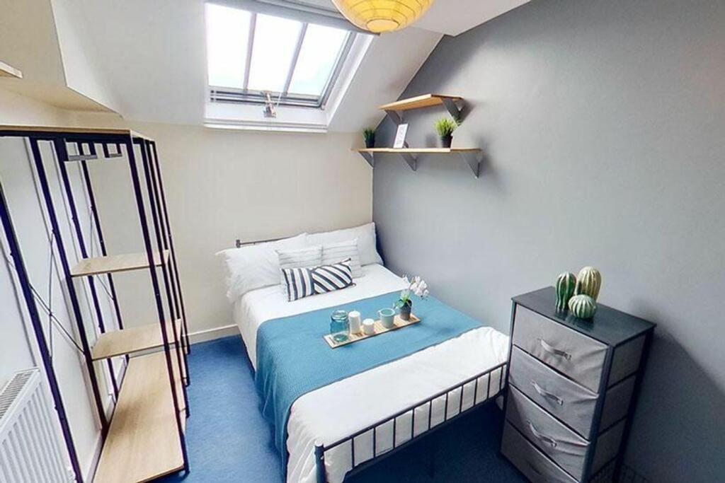 This inviting double bedroom features a cozy la...