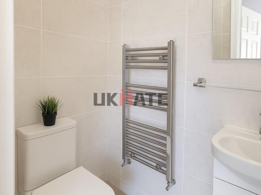 Modern and clean bathroom with a white toilet, ...