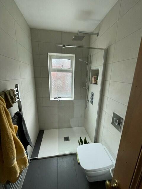 A modern, well-maintained bathroom with a spaci...