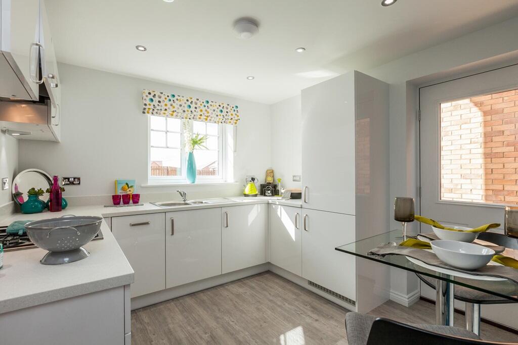 The kitchen to the rear of the home