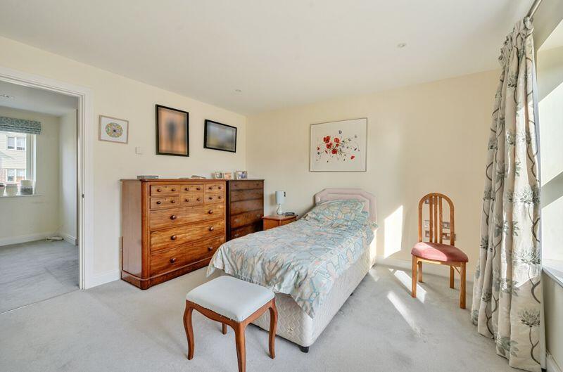 Master bedroom with fitted wardrobe a...