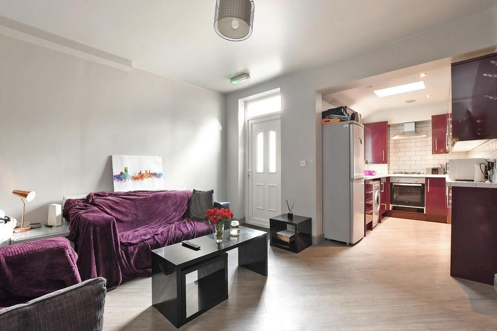 A bright and tidy living room space featuring a...