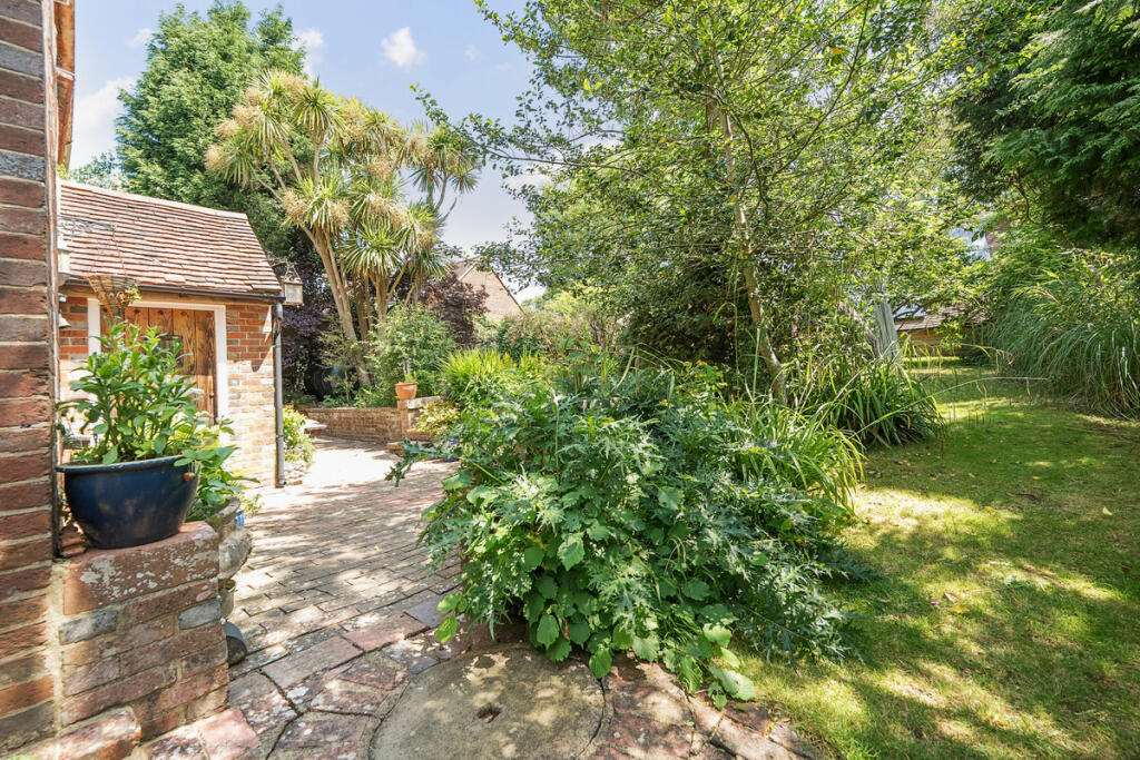 Front porch and East facing private and secluded front garden