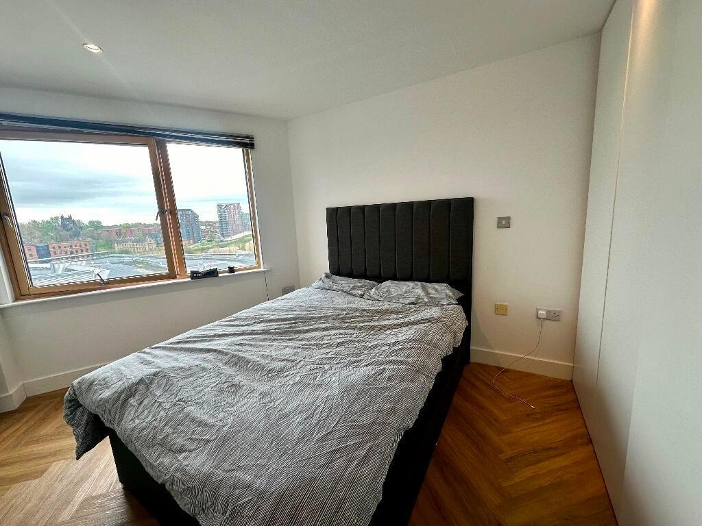 A modern double bedroom featuring a comfortable...