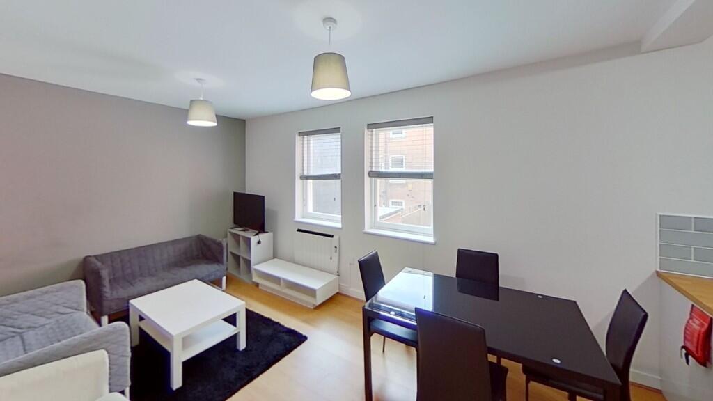 Bright and welcoming living room featuring a co...