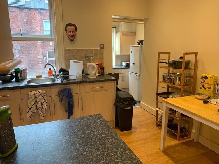 A well-used kitchen area with a bright workspac...