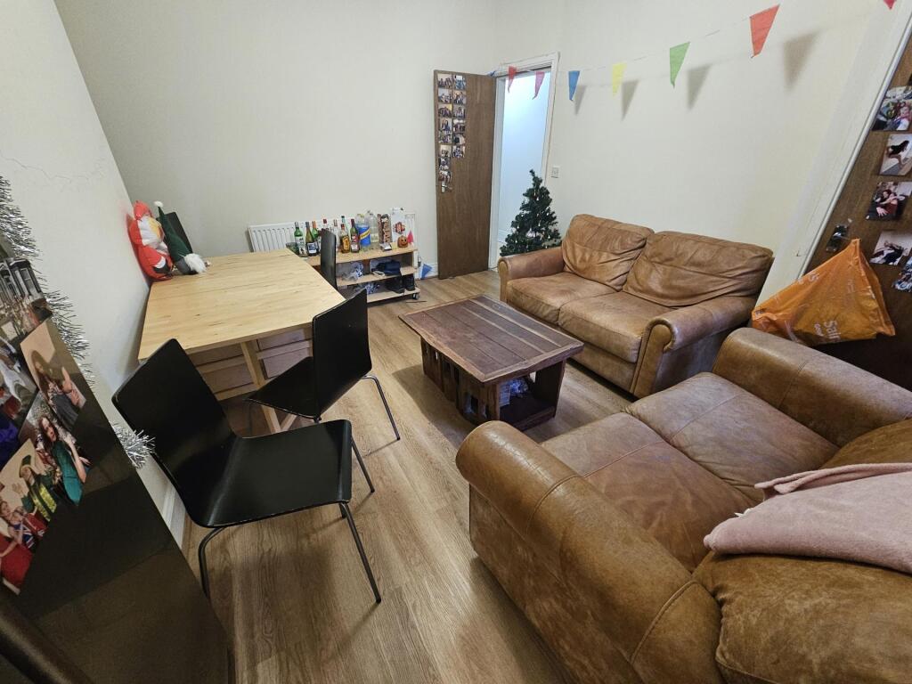 Cozy communal lounge with comfortable leather s...