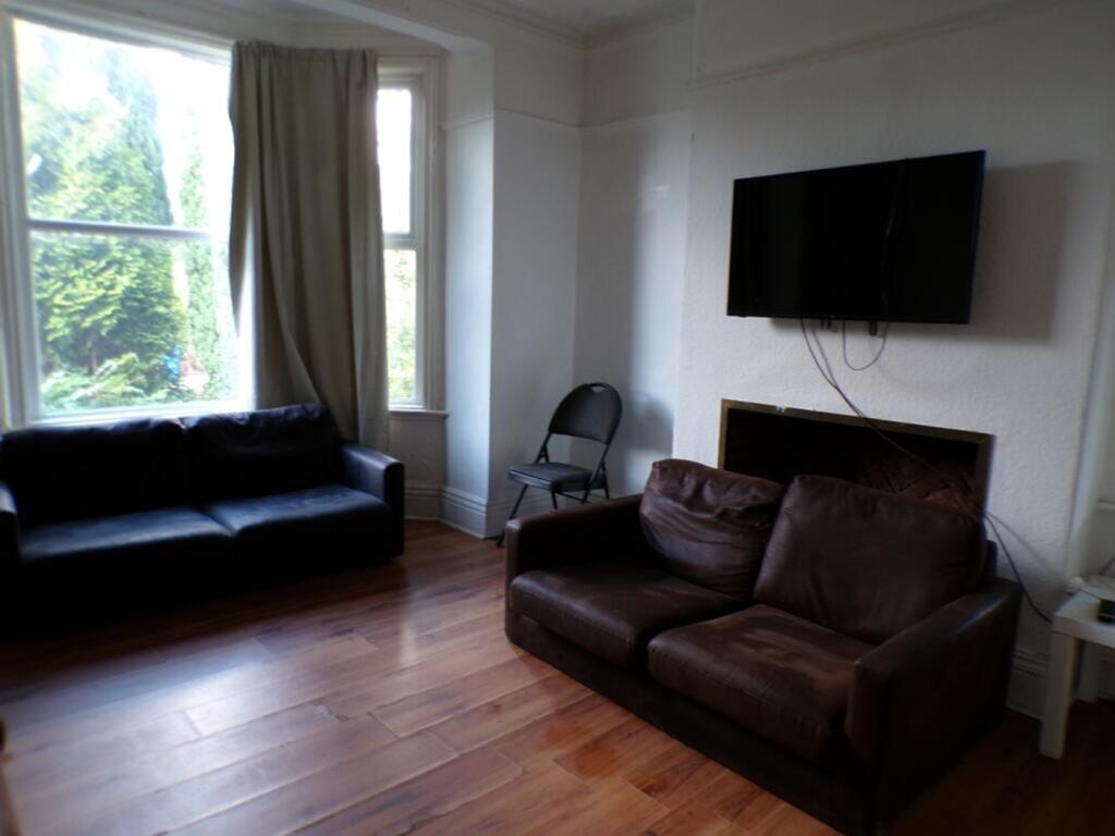 Bright and inviting living room featuring comfo...