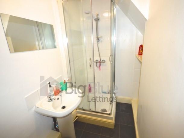 A neat and functional bathroom featuring a mode...