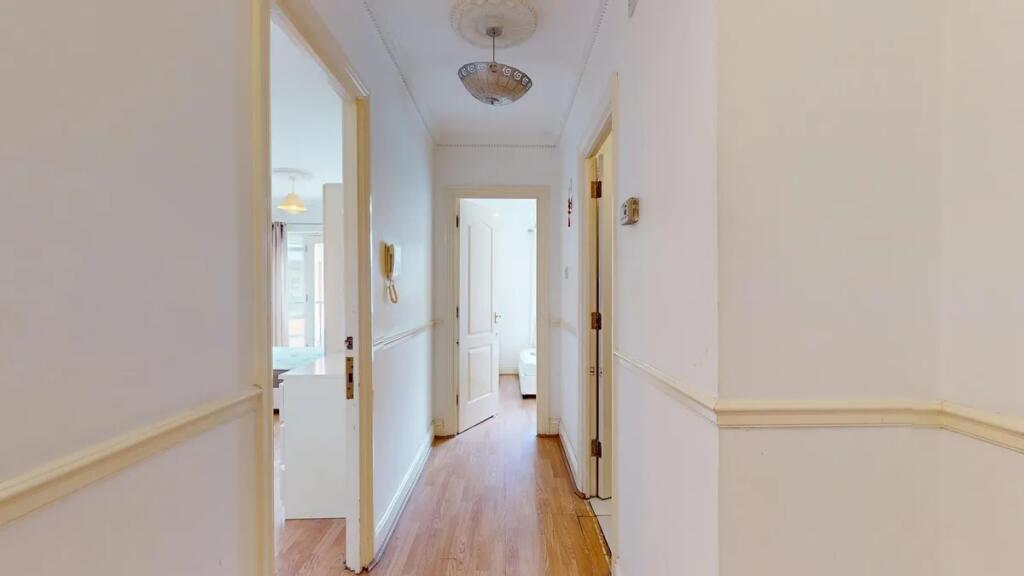 A clean and bright hallway featuring light-colo...