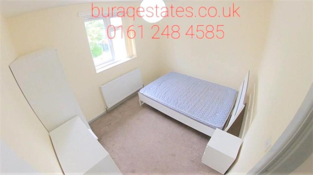 Bright, simply furnished single bedroom with a ...