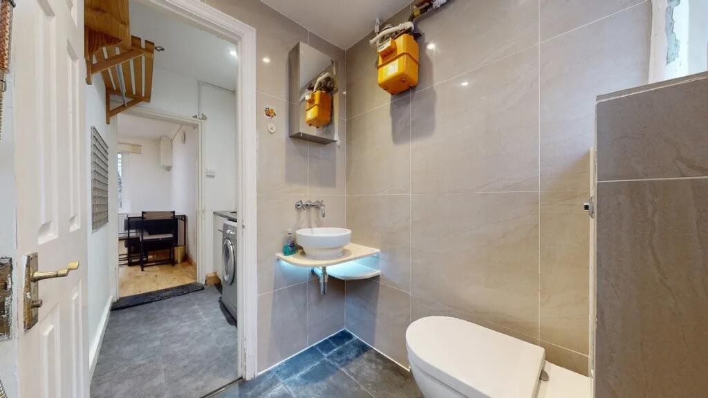 A modern and well-maintained single toilet with...