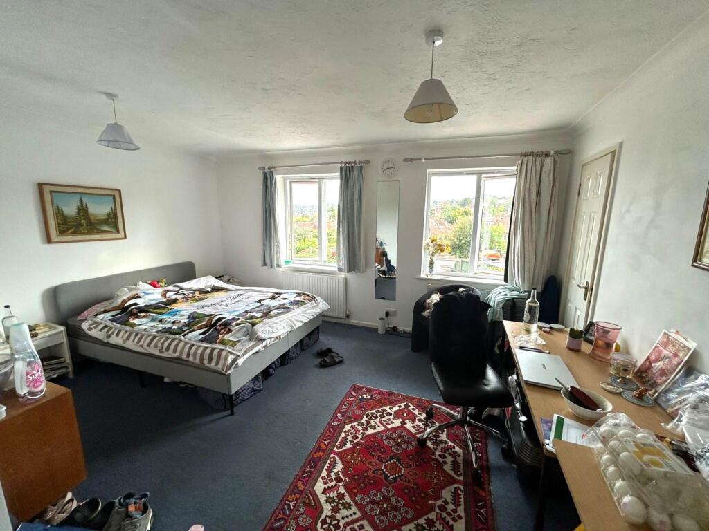 Bright, spacious bedroom with a large double be...