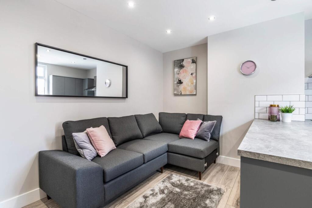A modern, well-maintained living room featuring...