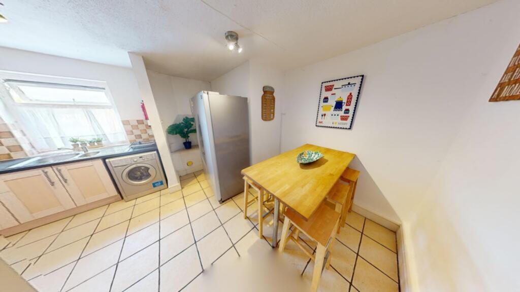 A bright and tidy kitchenette featuring modern ...