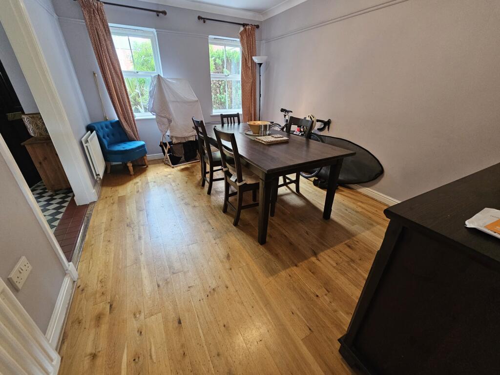 A bright and inviting living room featuring a w...