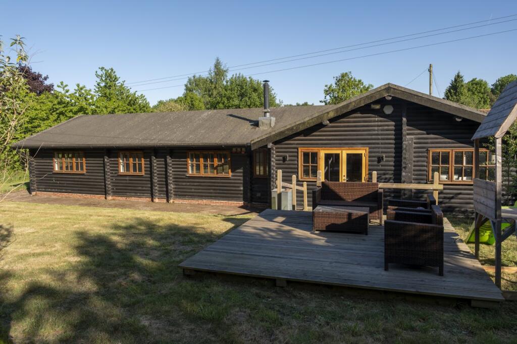 PatchingsLogCabinOutside.jpg