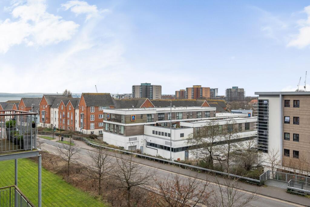 Open plan living space with balcony