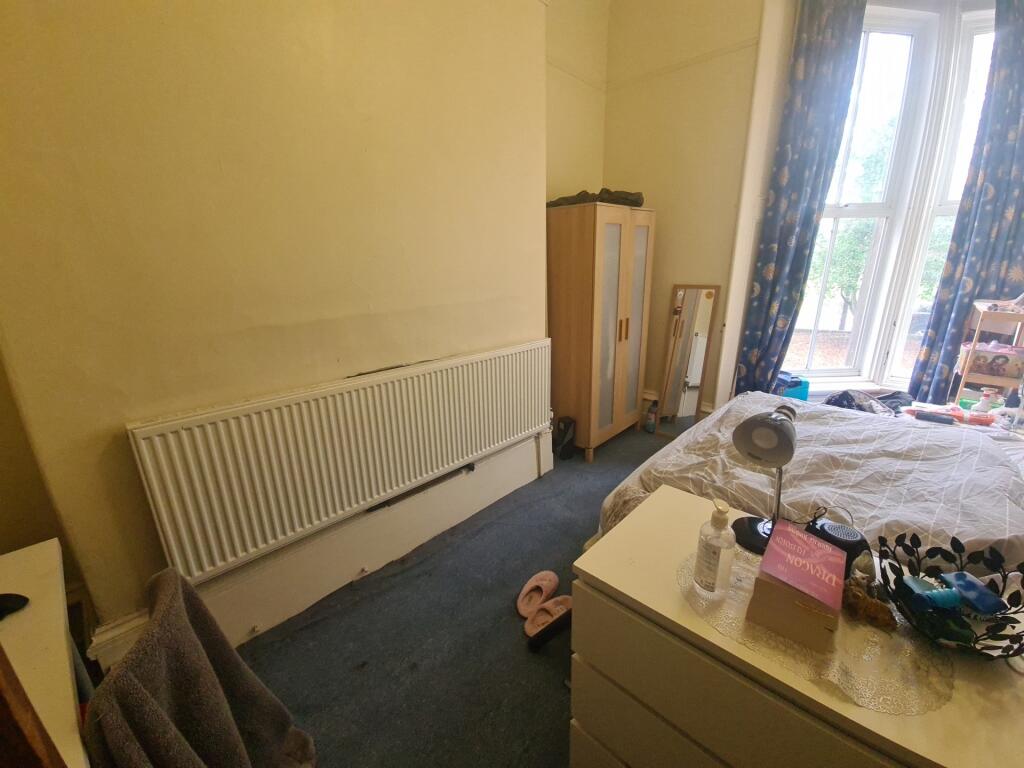 Bright and cozy double bedroom featuring a larg...