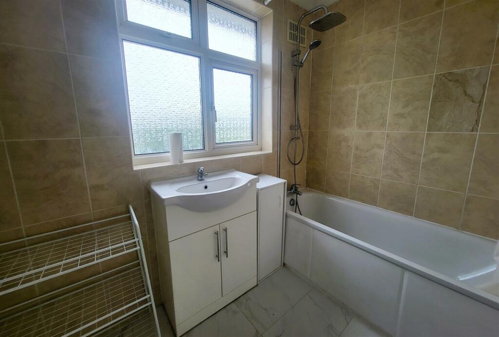 FULLY TILED BATHROOM:
