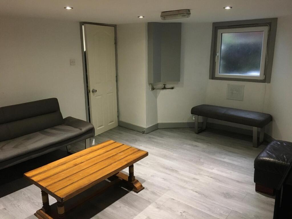 Bright, modern communal lounge with contemporar...