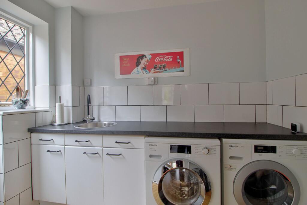 Utility has back door to garden