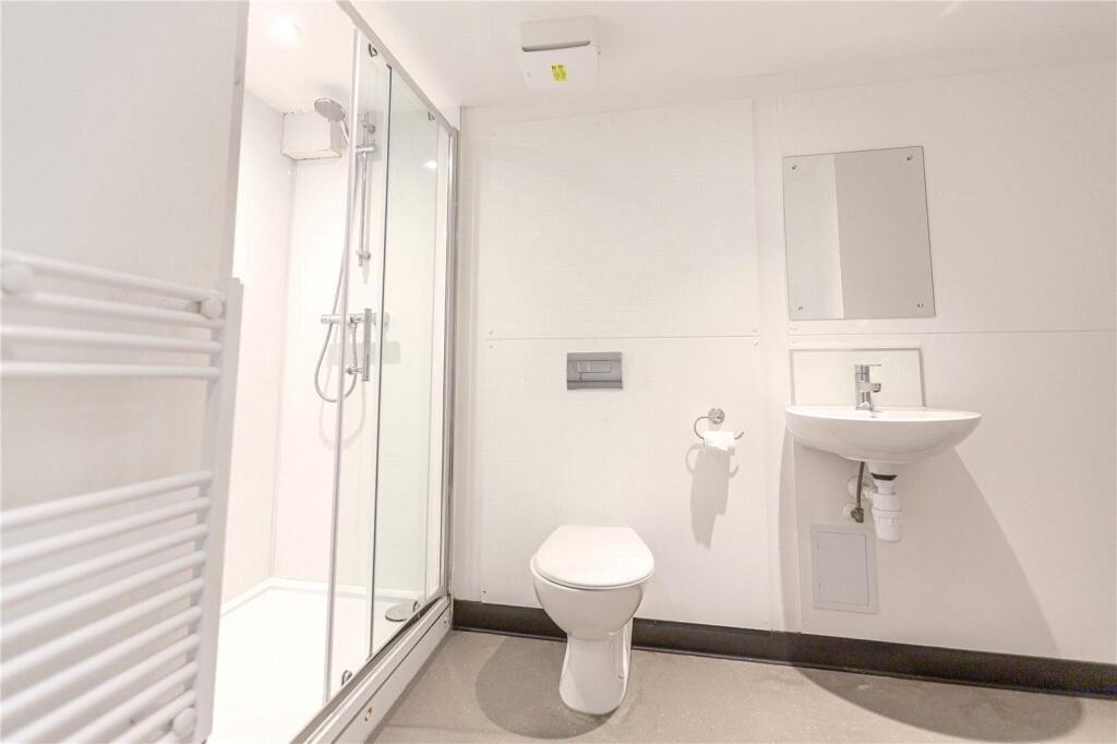Bright and modern bathroom featuring a spacious...