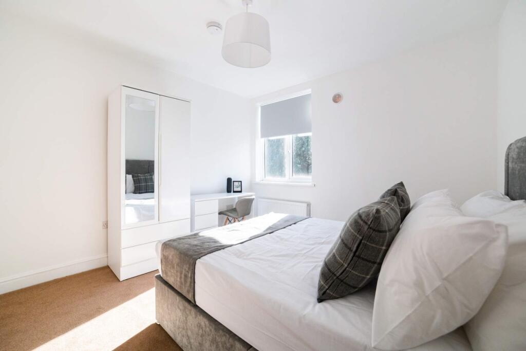 A beautifully designed double bedroom featuring...