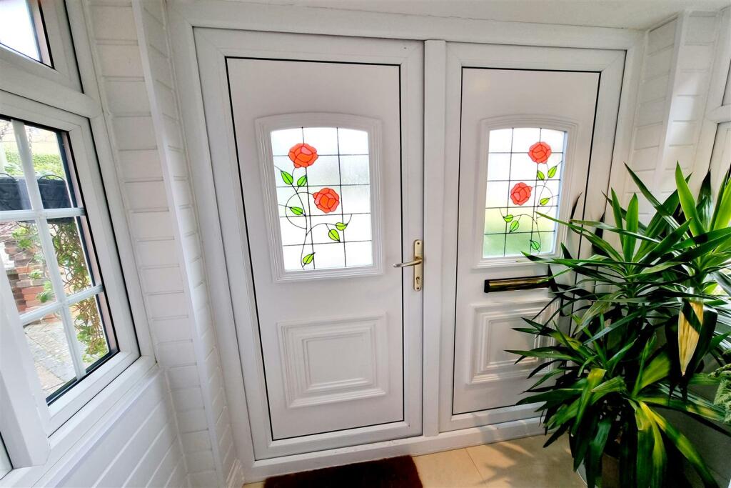 DOUBLE GLAZED ENTRANCE PORCH:
