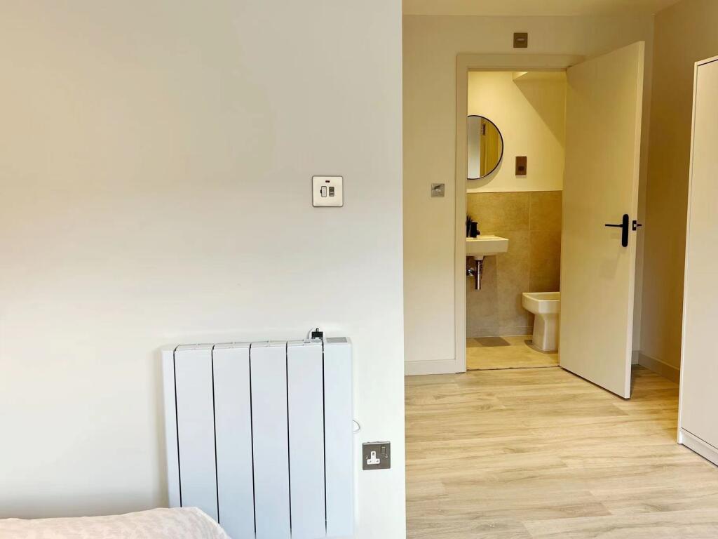 A clean and modern bathroom featuring a sink wi...