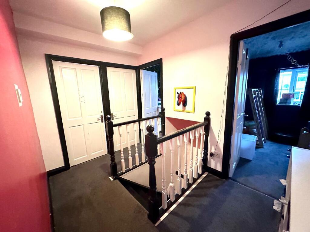 TO THE FIRST FLOOR LANDING