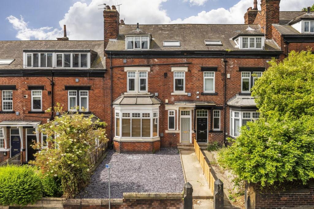 Attractive red-brick terraced house with a neat...