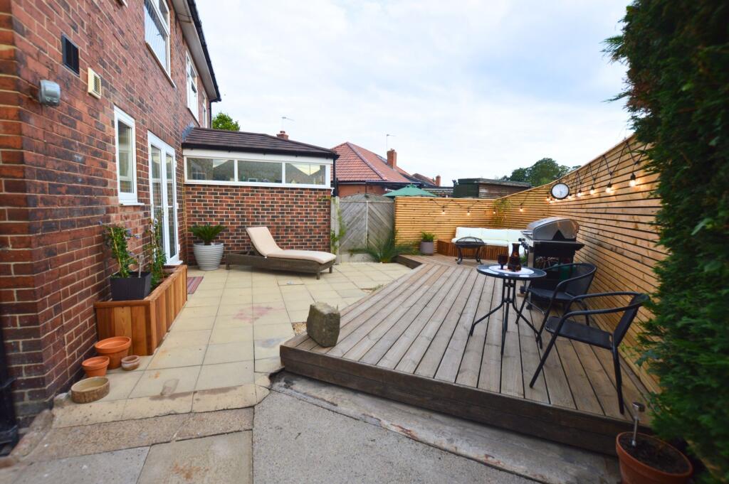 A charming and well-maintained outdoor garden s...