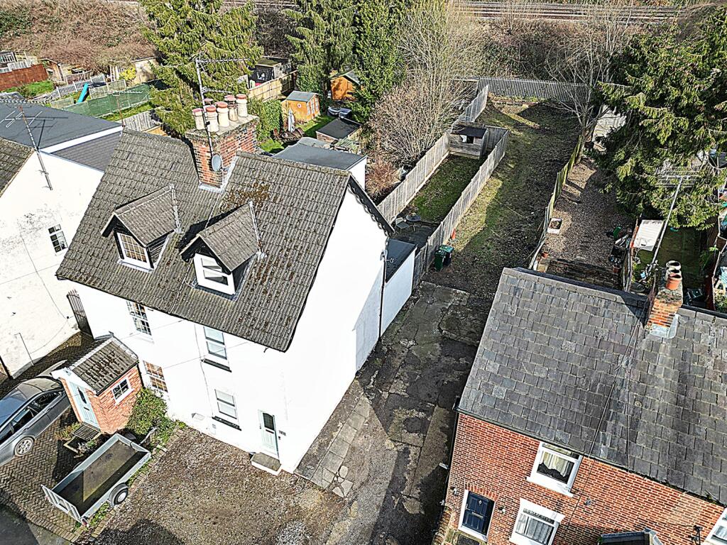 Exterior showing driveay and extended garden area