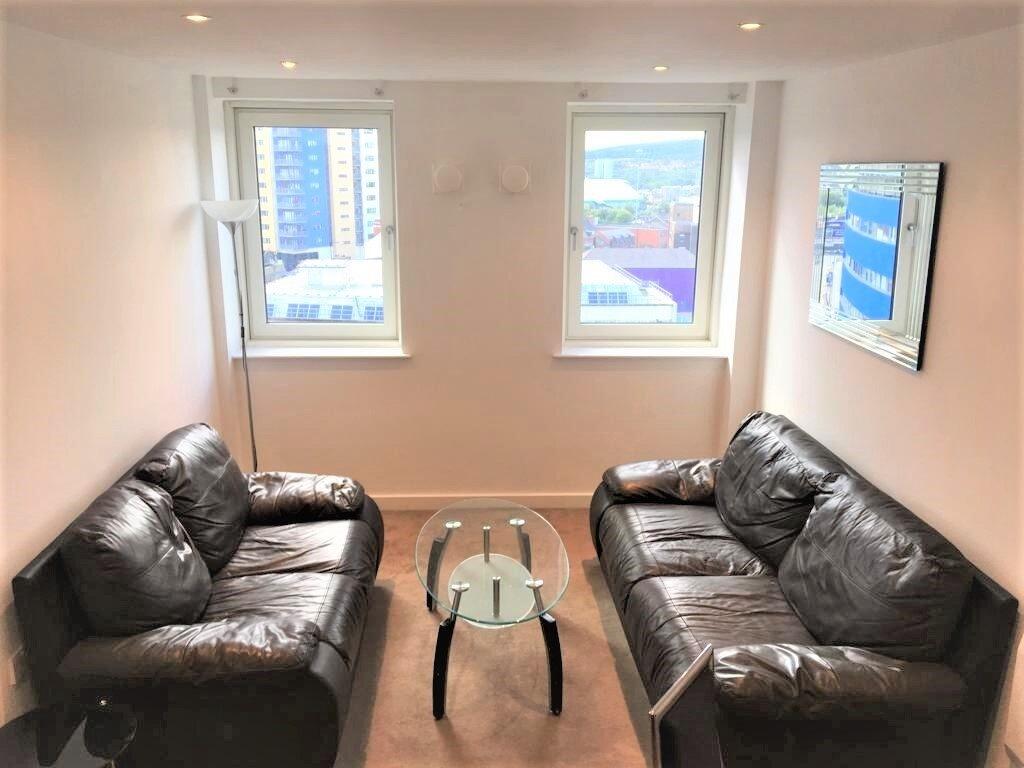 Bright and inviting living room featuring two c...