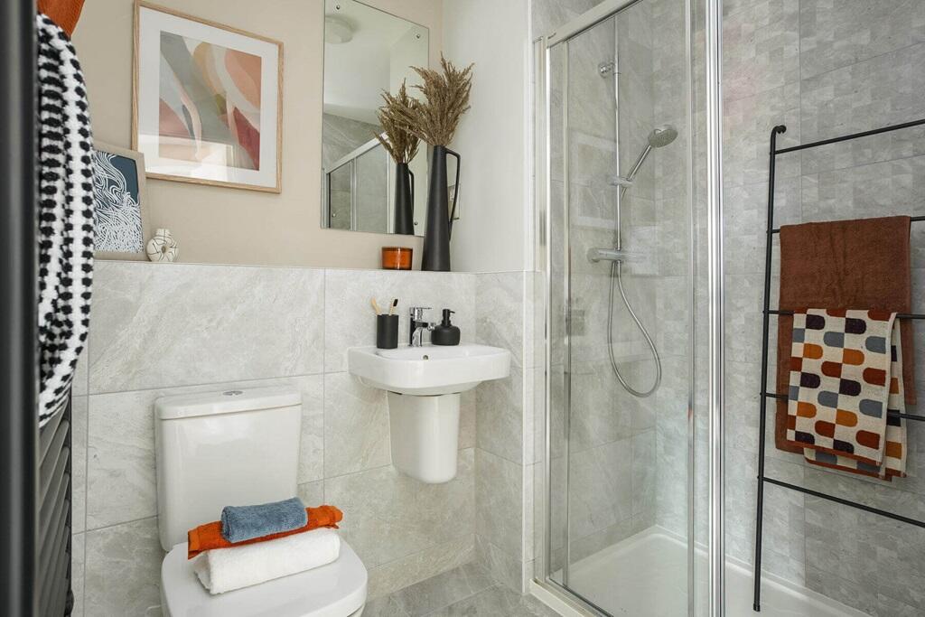 Bedroom 1 also hosts a private en suite shower room