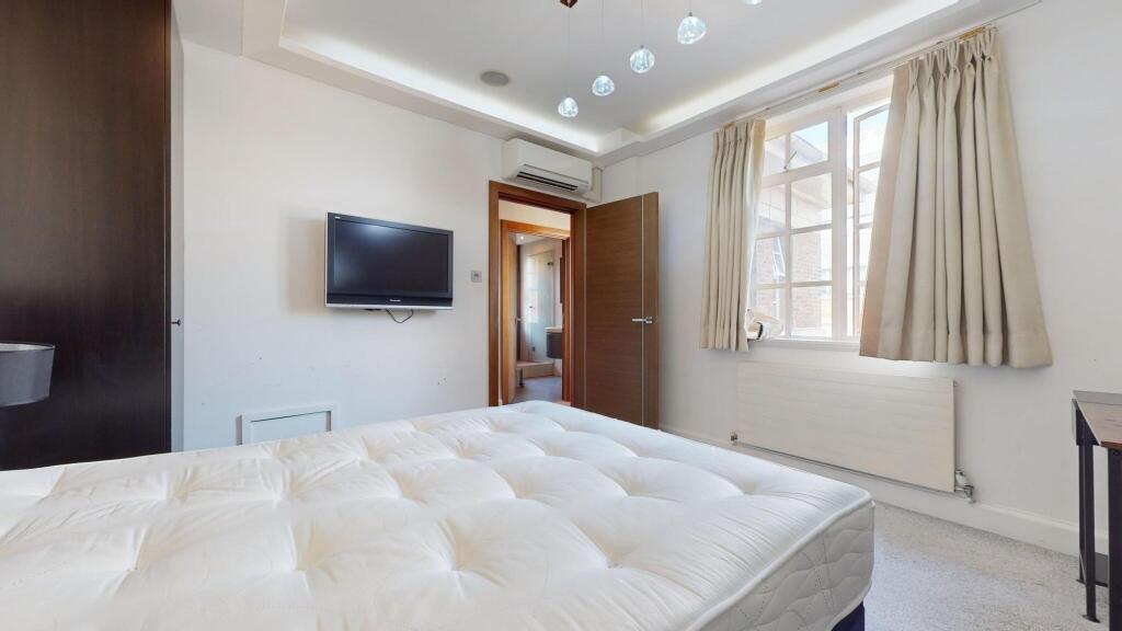 Bright and inviting double bedroom featuring a ...