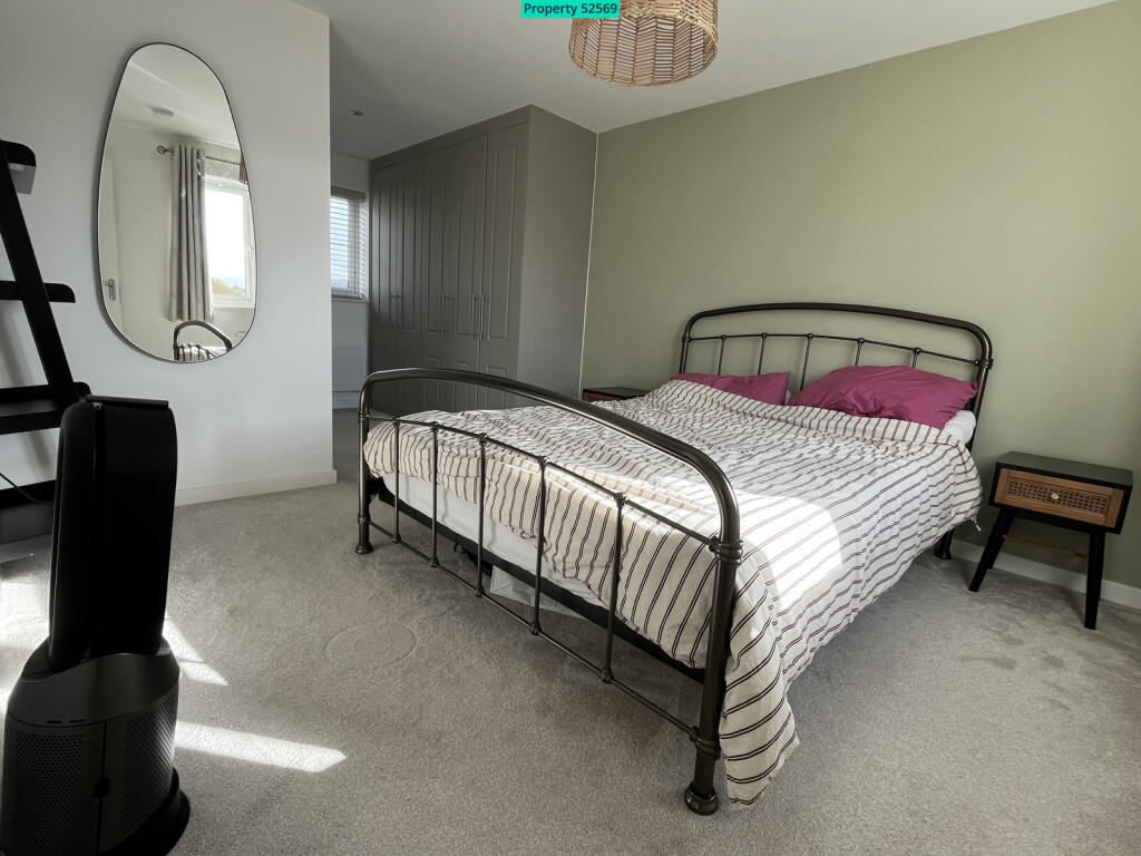 Dual aspect master bedroom with fitted wardrobes 