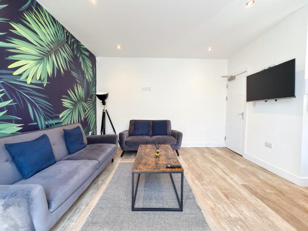 Bright contemporary living room with comfortabl...