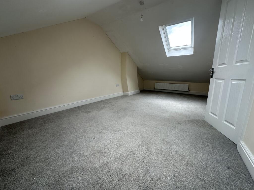 Bright and spacious double bedroom featuring a ...