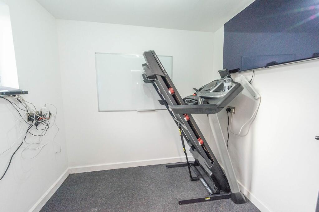 GYM TO THE REAR OF THE GARAGE