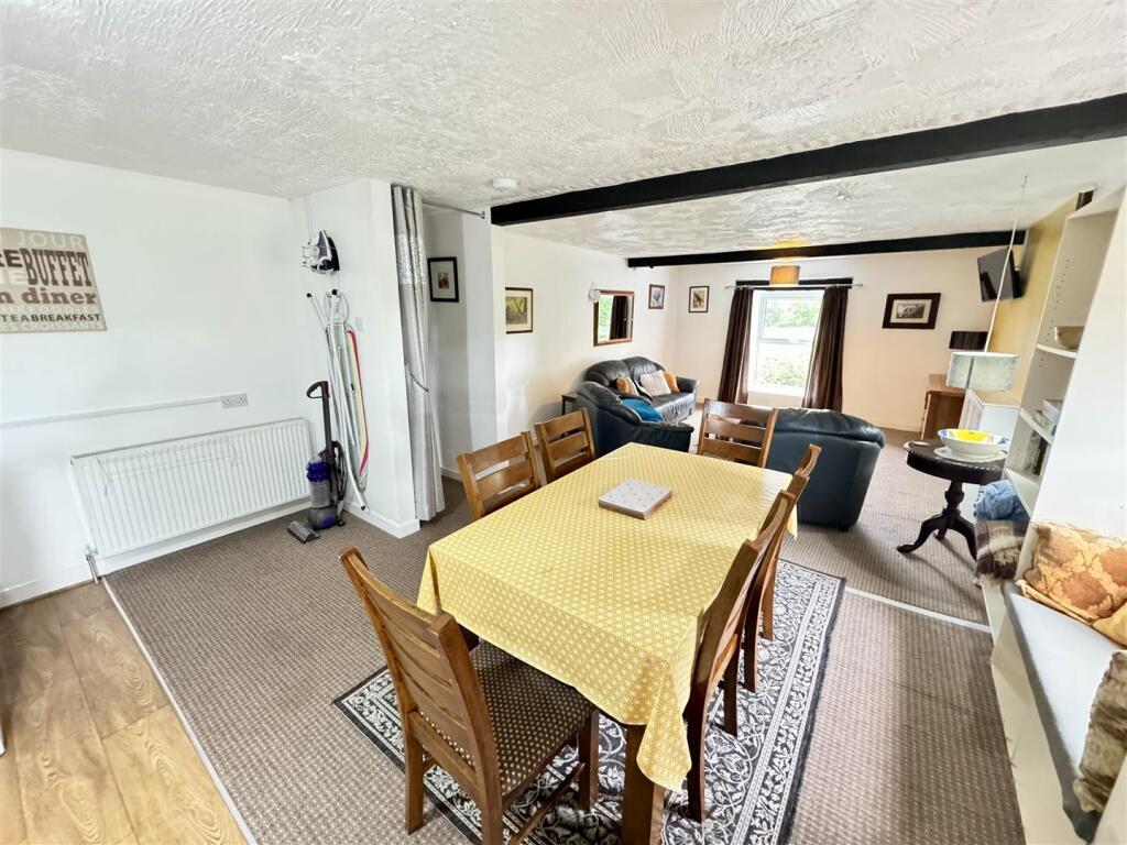 FRONT OPEN PLAN KITCHEN/ LIVING AND DINING AREA