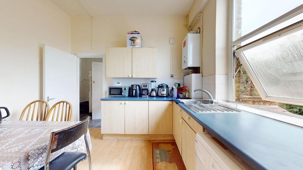 Bright and inviting kitchen featuring a large w...